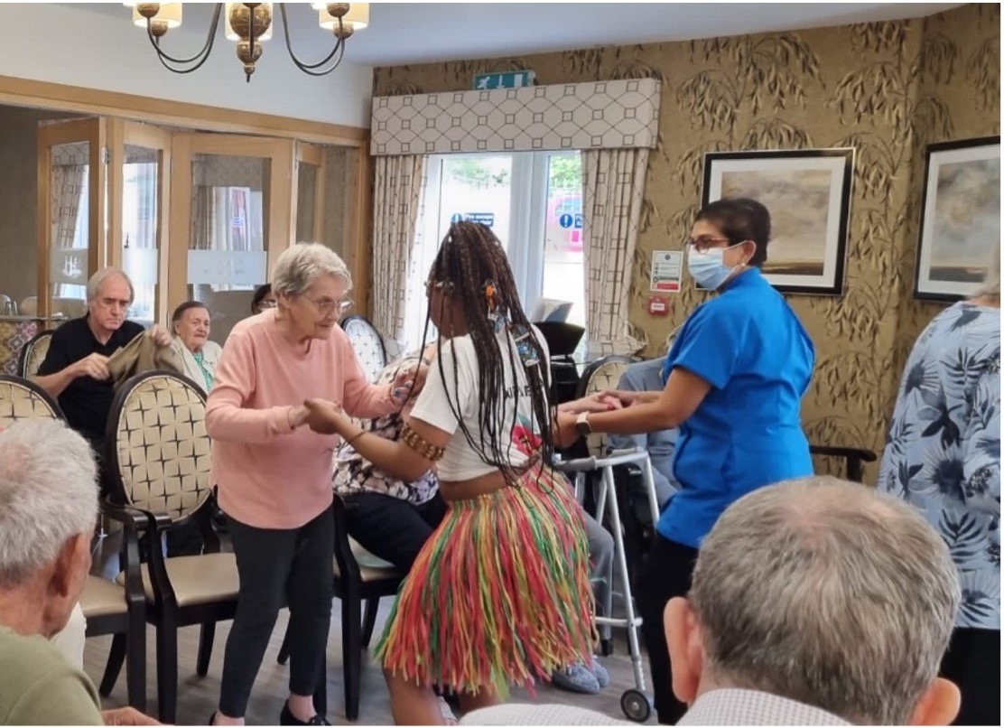 Residents Dancing with Drummers for Black History Month